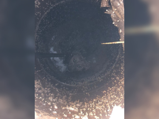 В Уфе спасатели достали собаку из двухметрового колодца